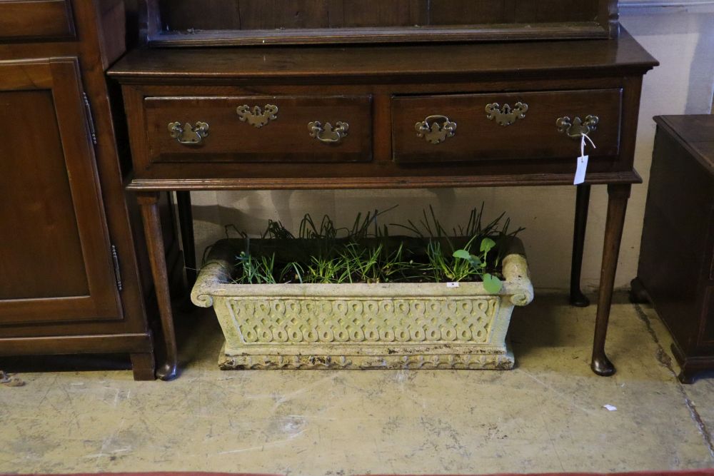 An 18th century oak low dresser with later boarded plate rack, width 128cm depth 46cm height 216cm